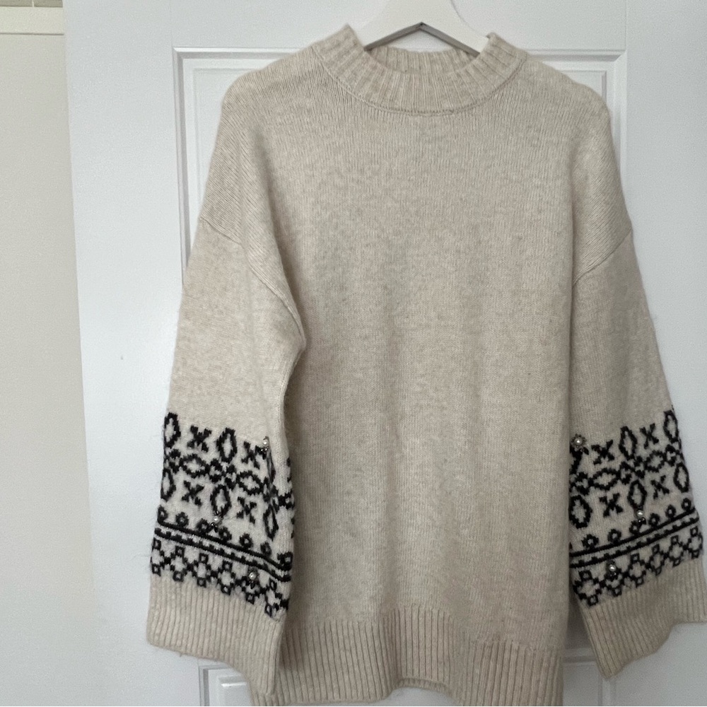Cozy Beige Sweater with Black Pattern